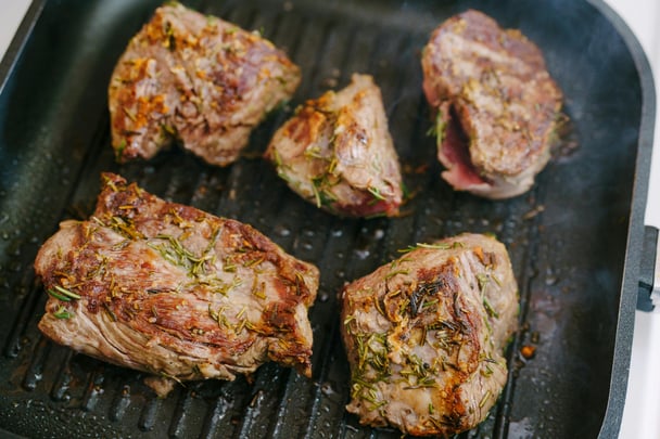 Lamb chops cooking.