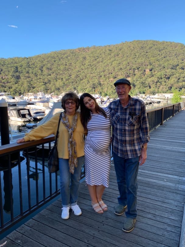 Leigh pregnant with her parents.