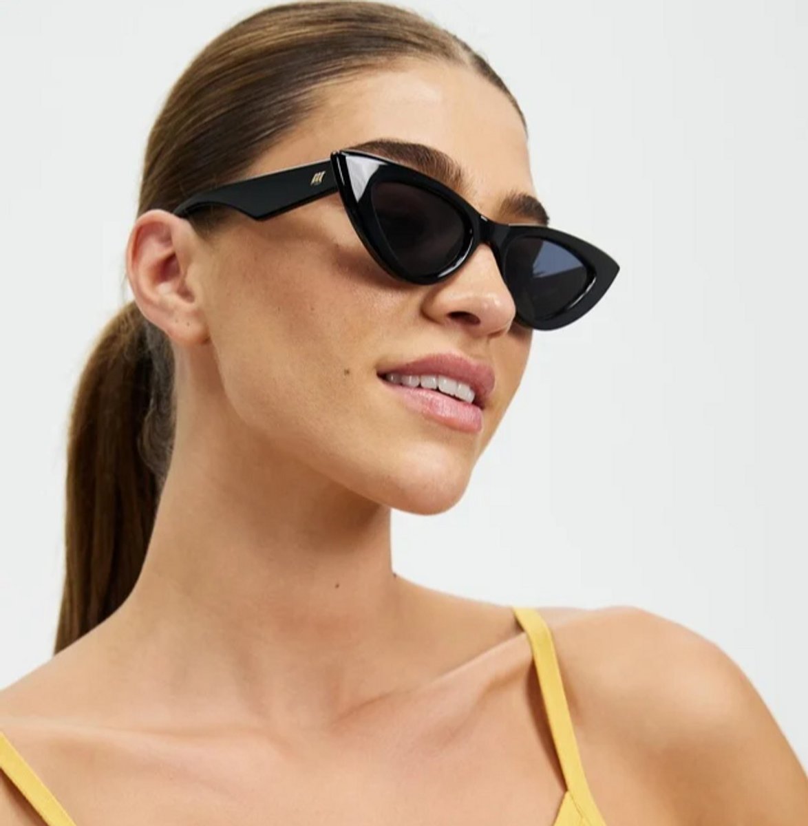 woman wearing black le specs sunglasses