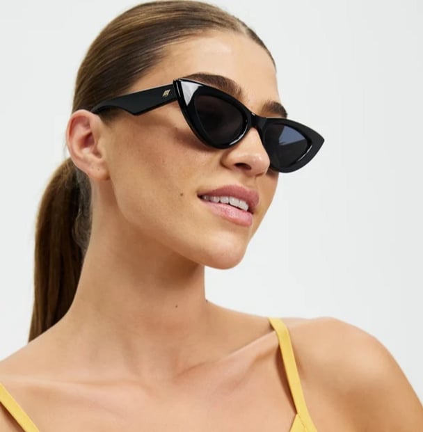 woman wearing black le specs sunglasses