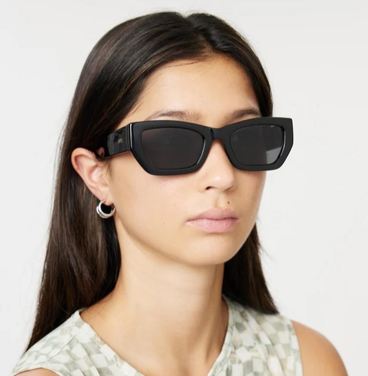 woman wearing local supply black sunglasses