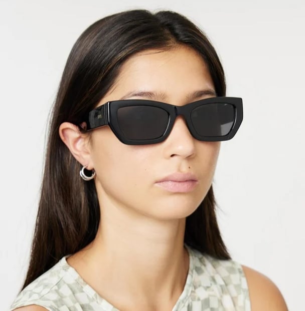 woman wearing local supply black sunglasses