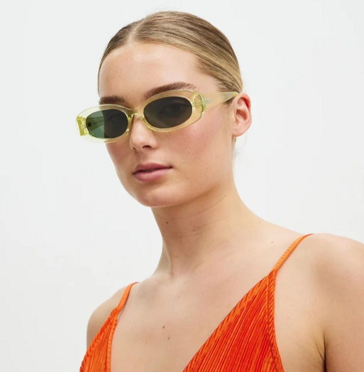 woman wearing citrus yellow sunglasses