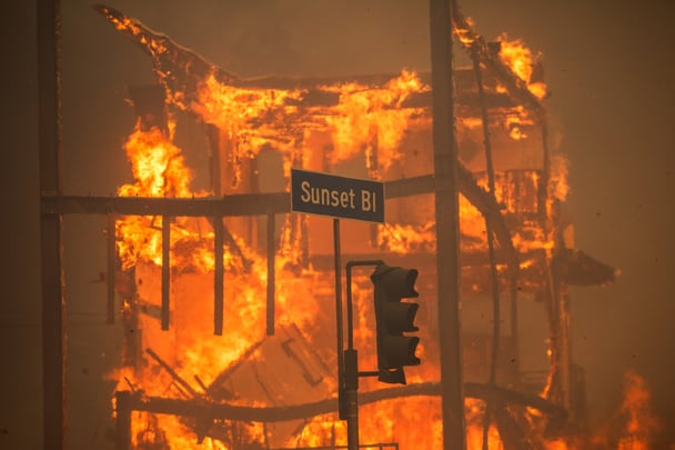 A building is destroyed by uncontained wildfires on Sunset Boulevard, LA.