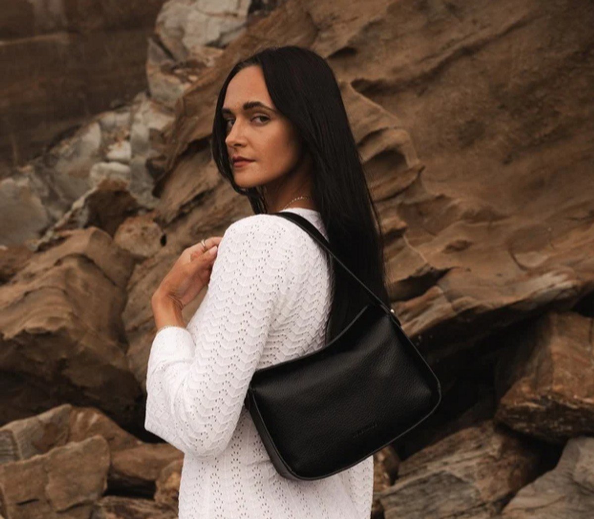 woman with black shoulder bag 