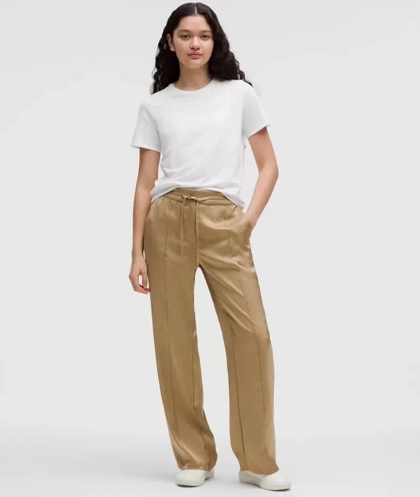 woman wering satin track pants from lululemon