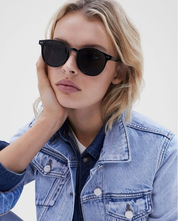 woman wearing black oval sunglasses 