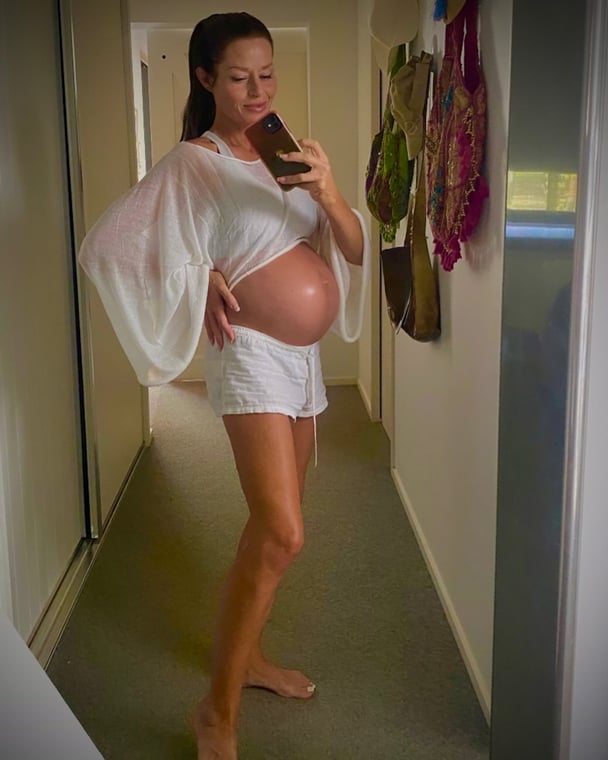 Madeleine West shows off her baby bump in a mirror selfie.