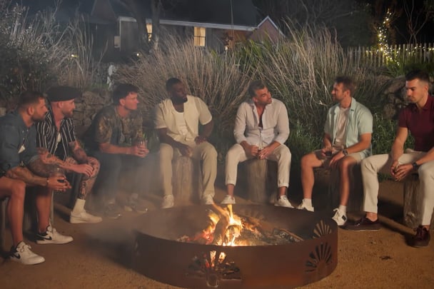 The MAFS men around a campfire.