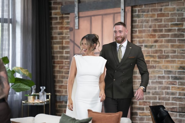 Bec and Danny enter the dinner party.