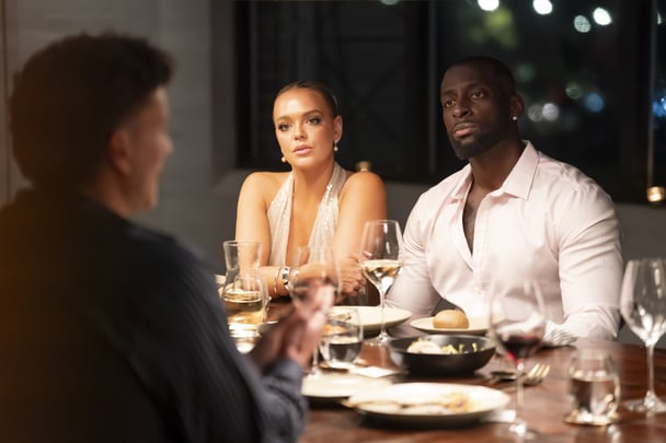 Alissa and David chat at the dinner table.