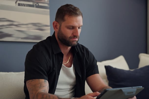 Scott watches the iPad.
