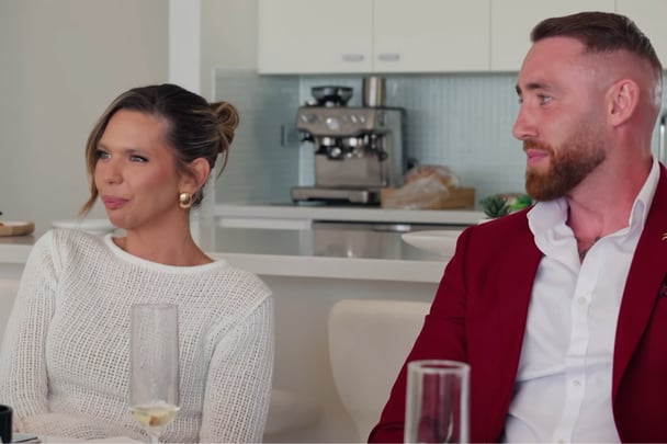 Bec and Danny sitting at the table.