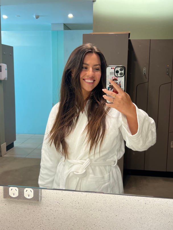 Helena takes a mirror selfie wearing a robe.
