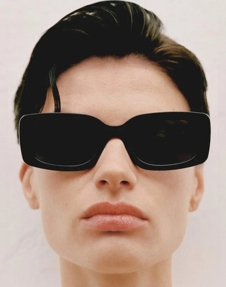 woman wearing oversize black sunglasses