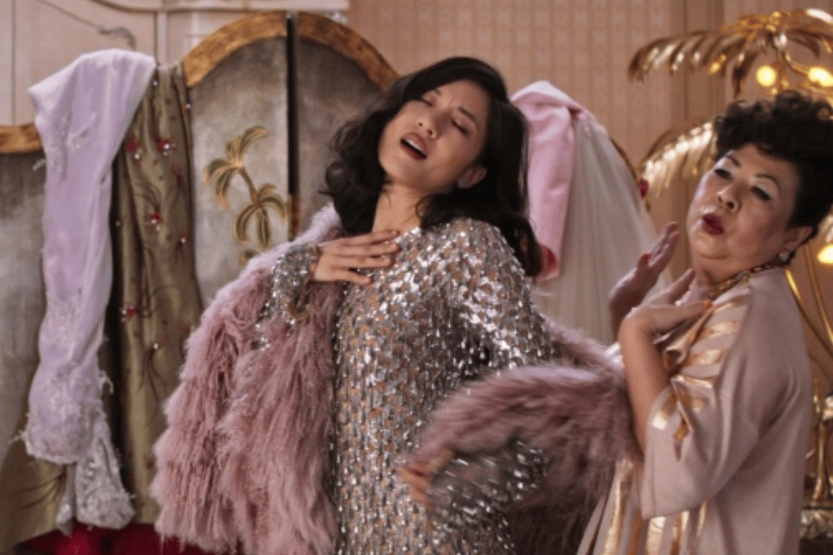 Constance Wu wearing a sparkly gown in Crazy Rich Asians.