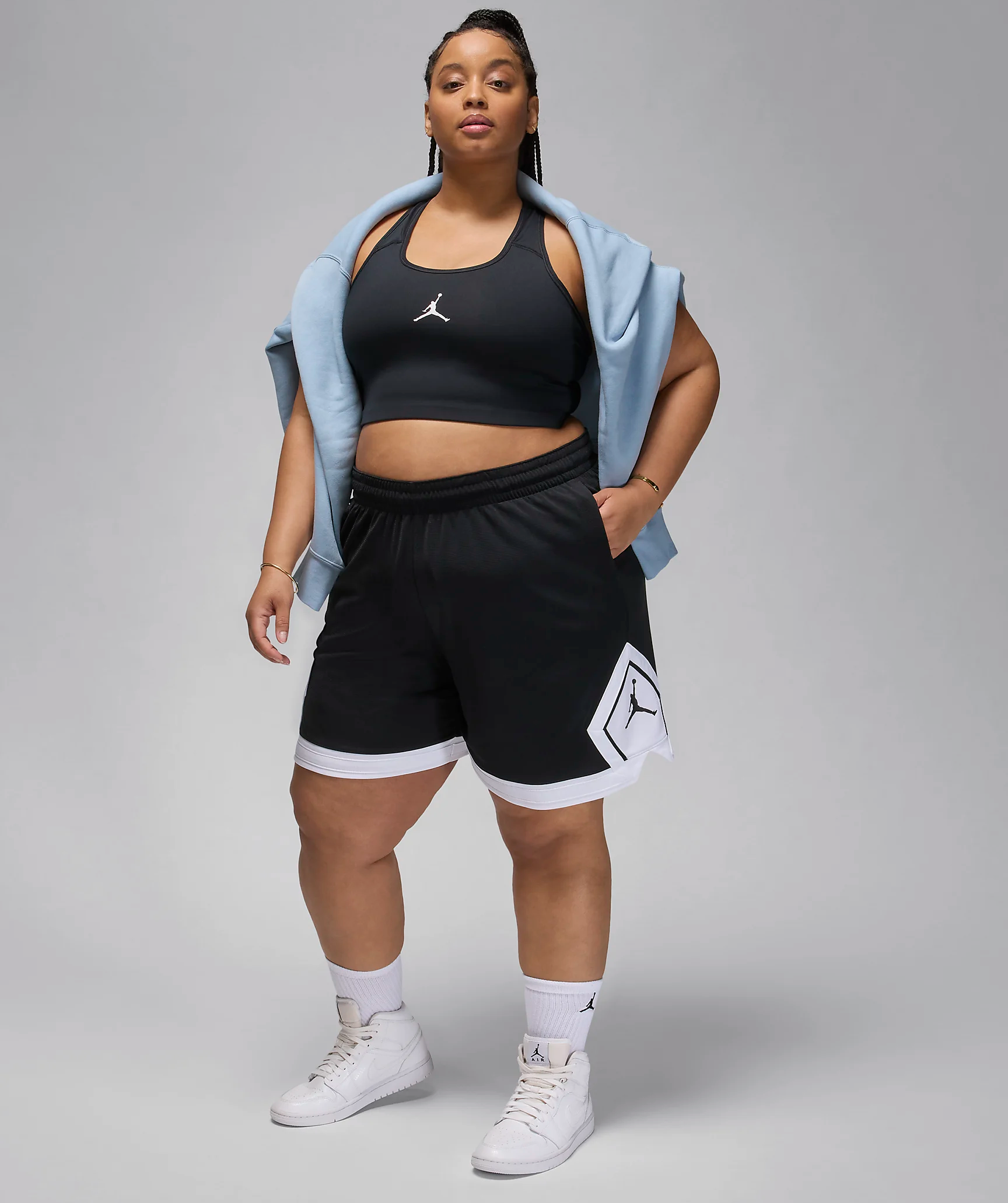 woman wearing Nike basketball style shorts 