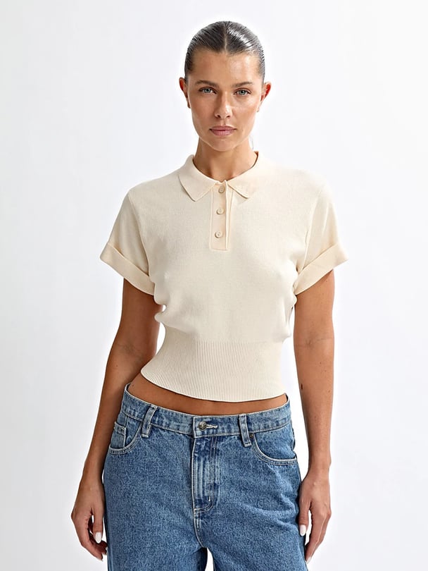 Butter coloured cropped polo tee with sinched waist.