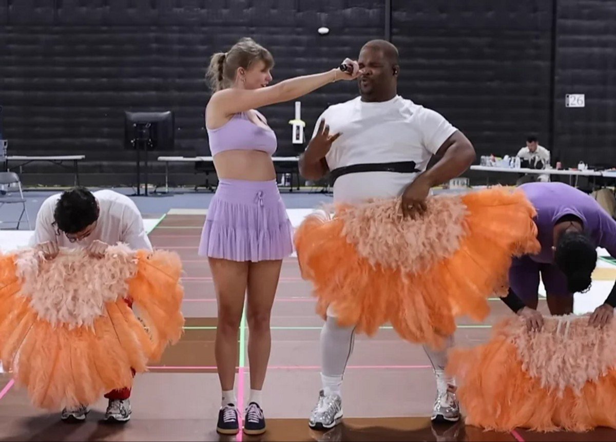 Taylor Swift!!! In the music video for I Can Do It With A Broken Heart, her dancers carried orange fans instead of white. 