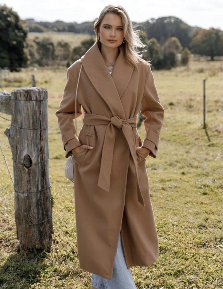 woman wearing camel coloured front tie coat