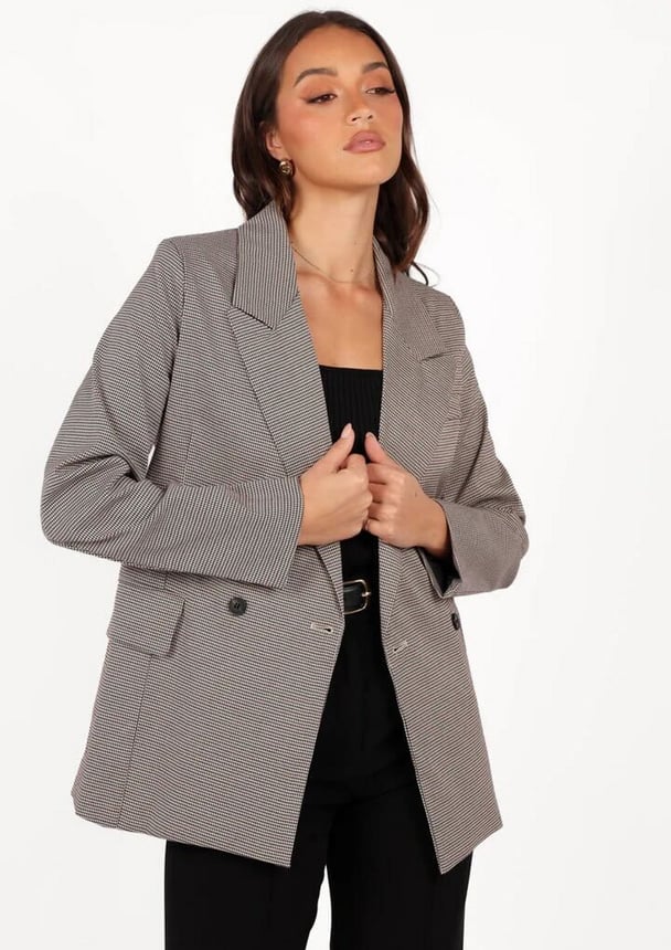 woman wearing checkered jacket 