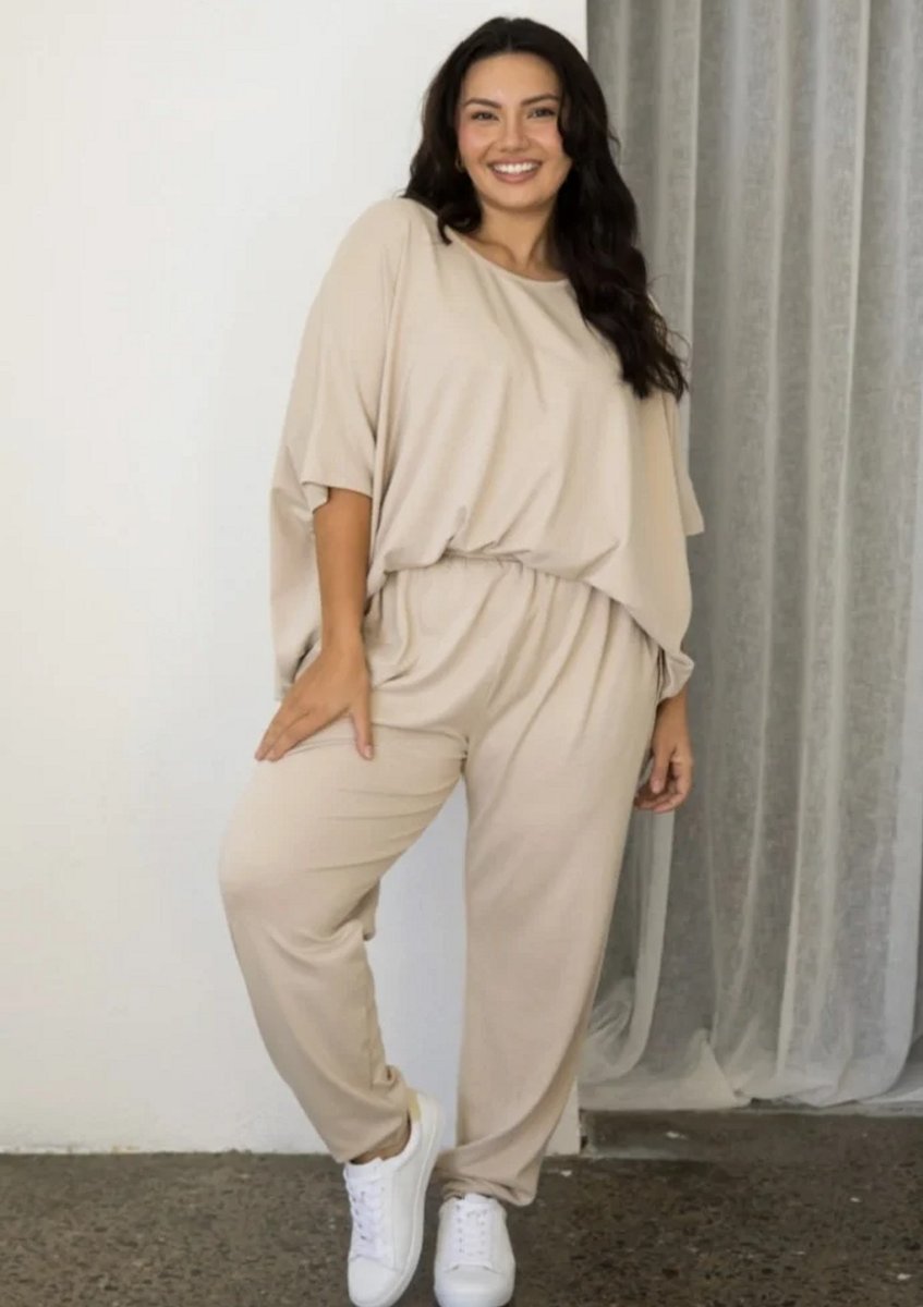 woman wearing beige loungesuit 