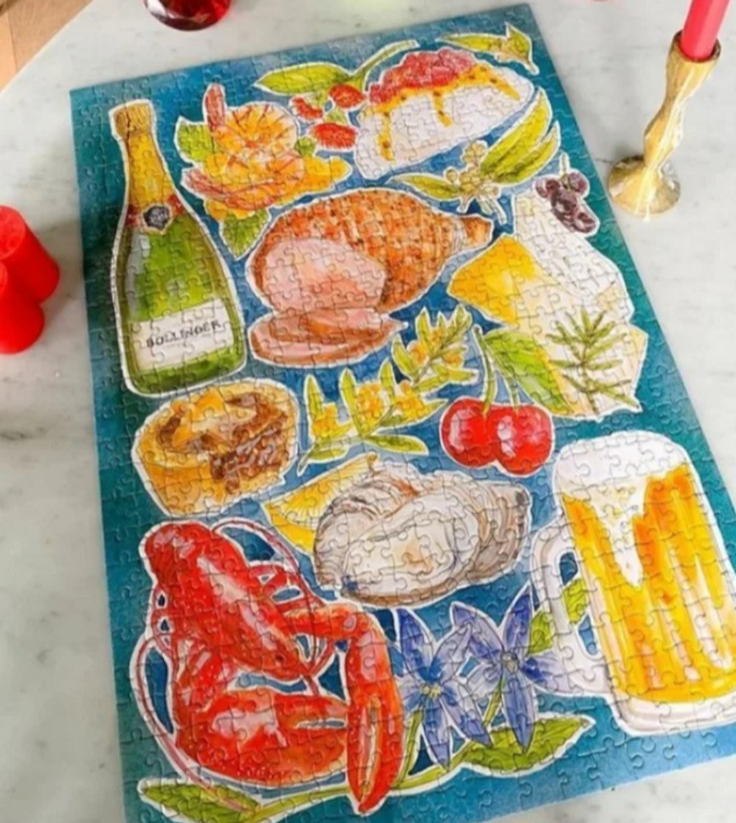 500 piece puzzle with a picture of a prawn, beer, christmas ham, pavlova, champagne 