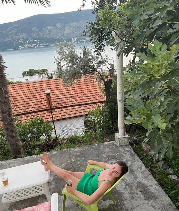 woman sitting on a deck in Croatia