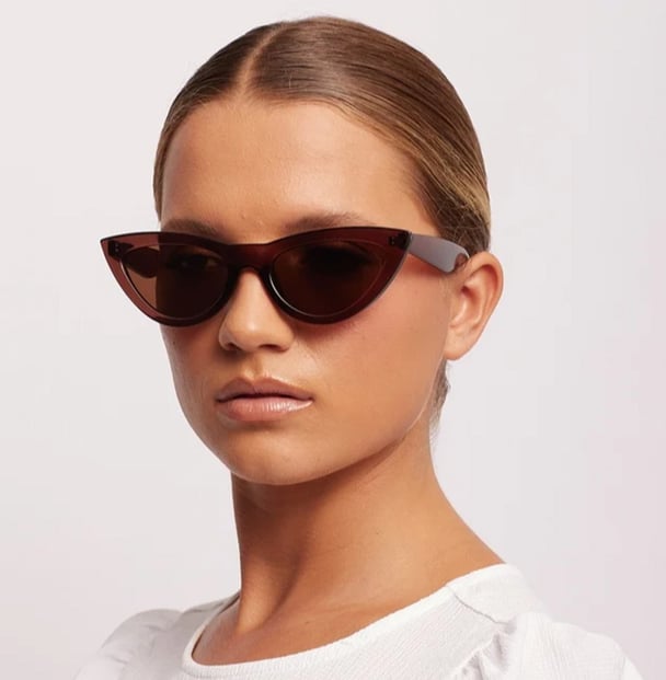 woman wearing taupe cat eye sunglasses