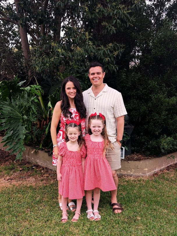 Rebecca with her husband and their two young daughters.