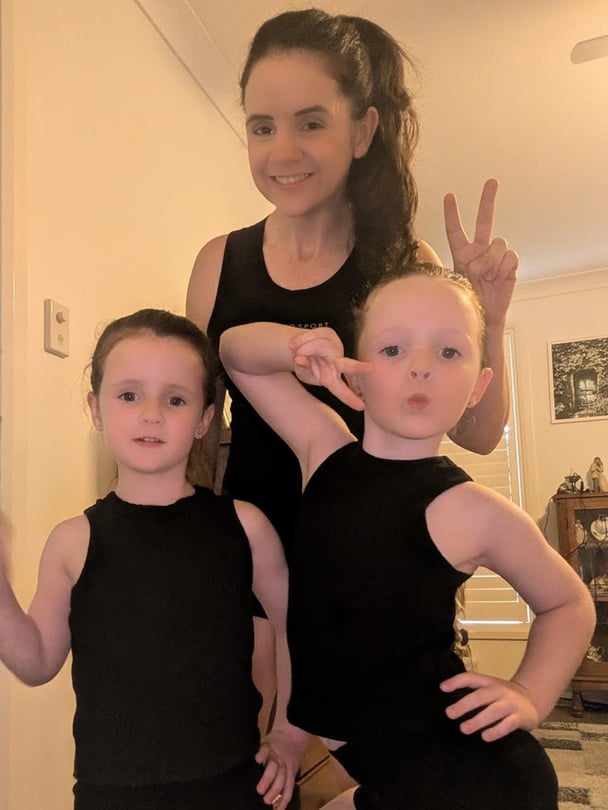 Rebecca with her two young daughters.