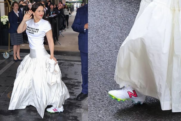 Rosalía on the way to a met gala fitting in football boots
