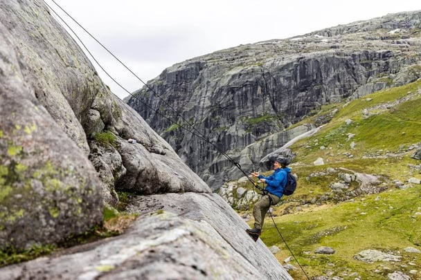 Matthew McConaughey scales a mountain with Bear Grylls.