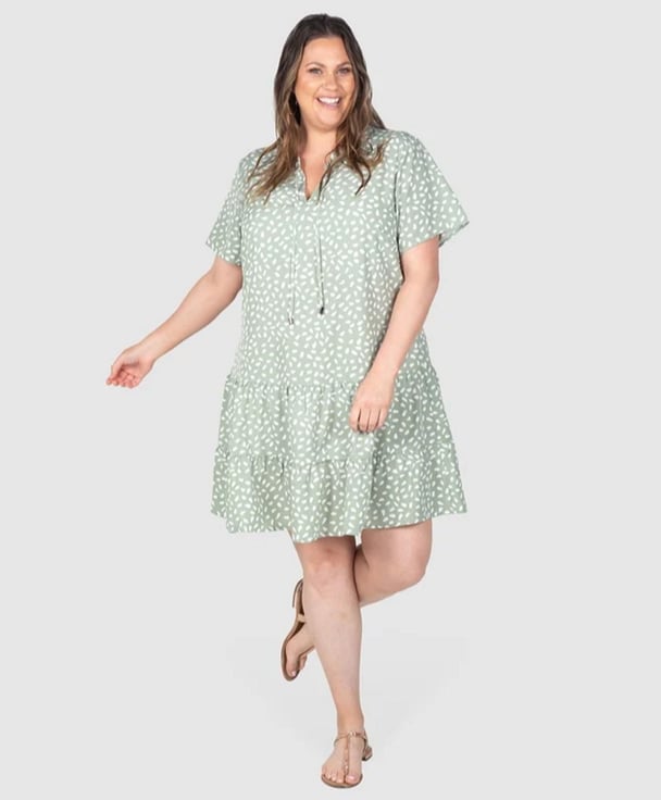 woman wearing sage green dress