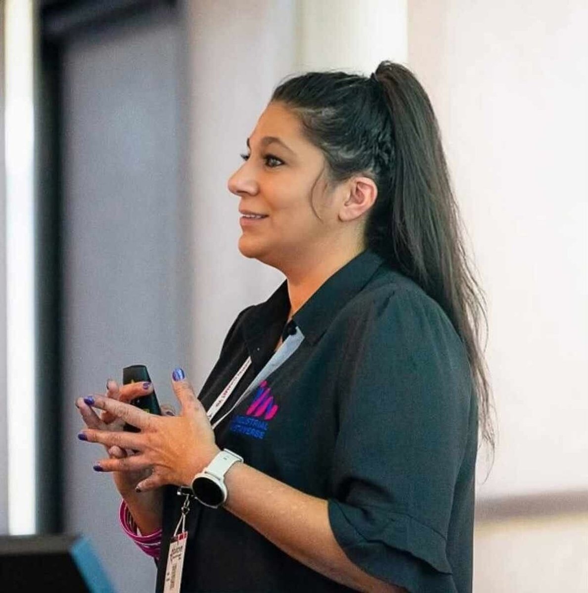 Former meth addict Sarah Hussein speaking at an event for her business, Industrial Metaverse.