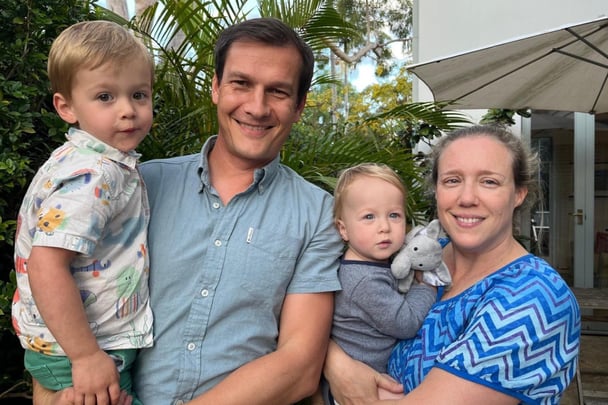 Sassica smiles with her two toddlers and her husband.