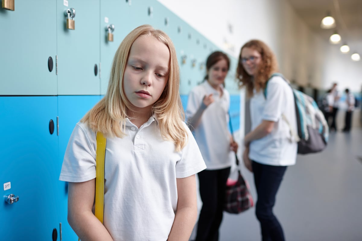 A young school student is bullied by her peers.