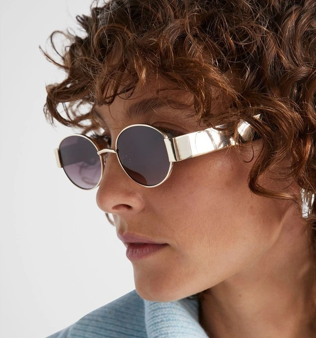 woman wearing gold sunglasses 