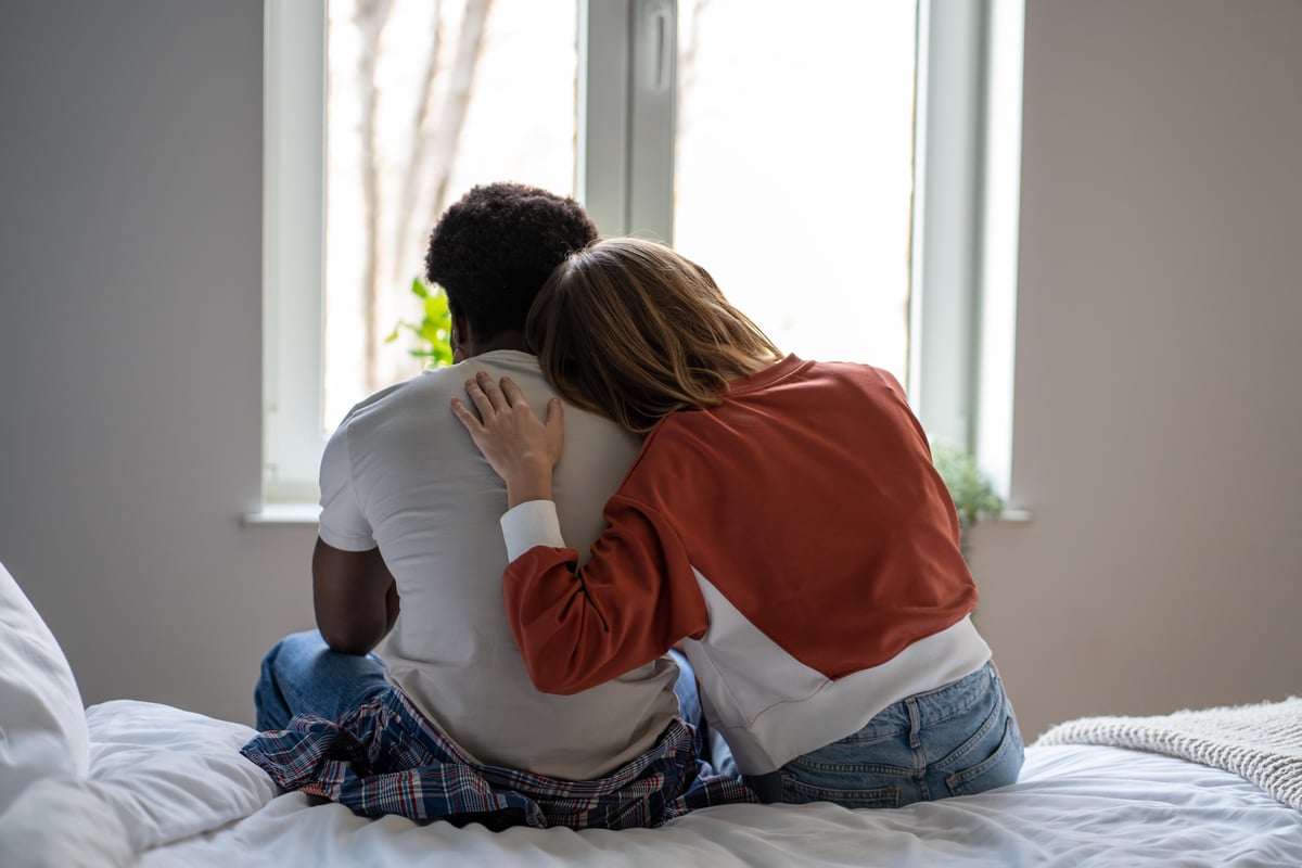 A woman and a man who are married and not having sex comfort one another.