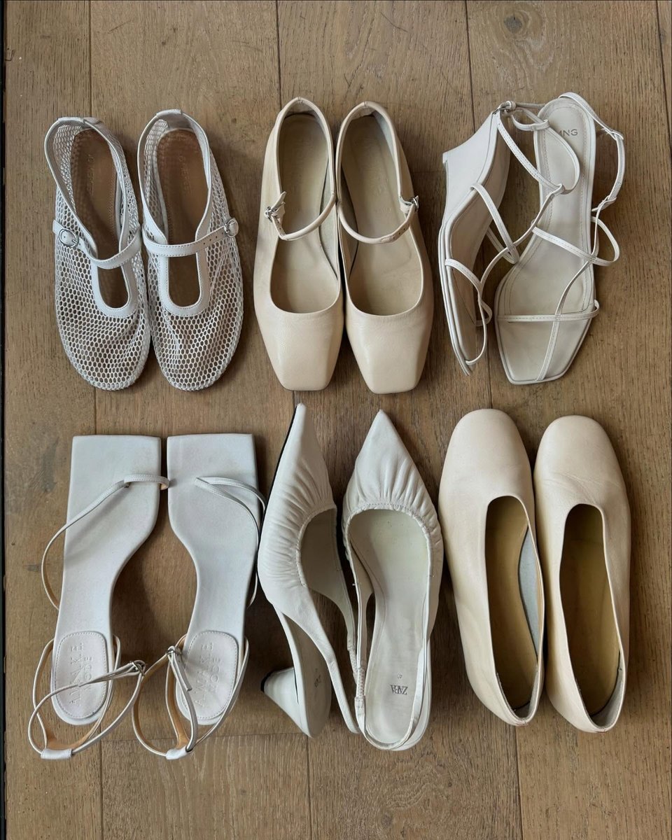 Six pairs of white women's shoes.