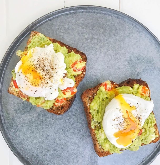 Smashed avocado and poached eggs on toast.