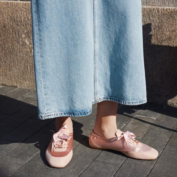 woman wearing pink sneakerinas
