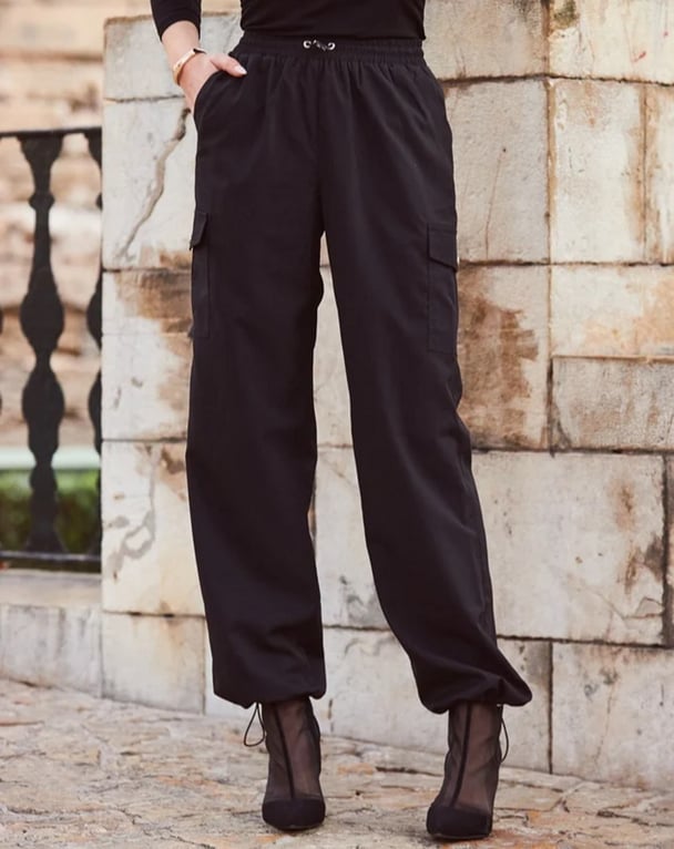 woman wearing black pants with draw string