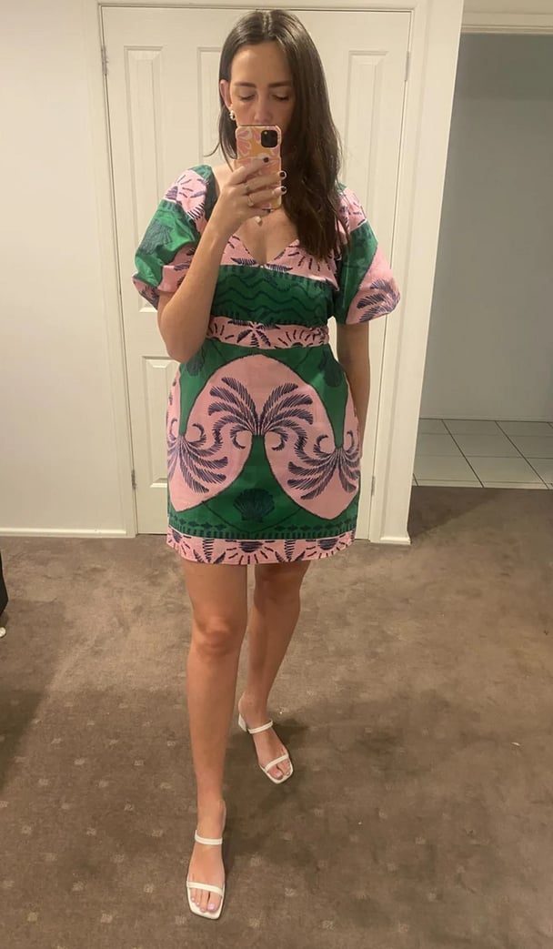 woman wearing pink and green dress