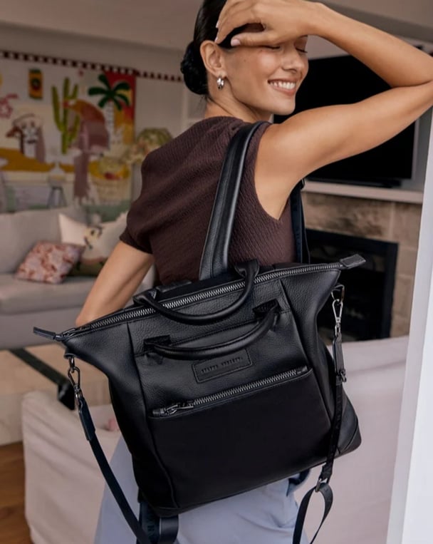 woman wearing black work backpack