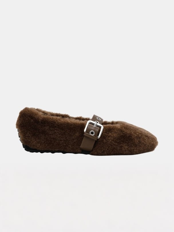 Brown fluffy mary janes with buckle.