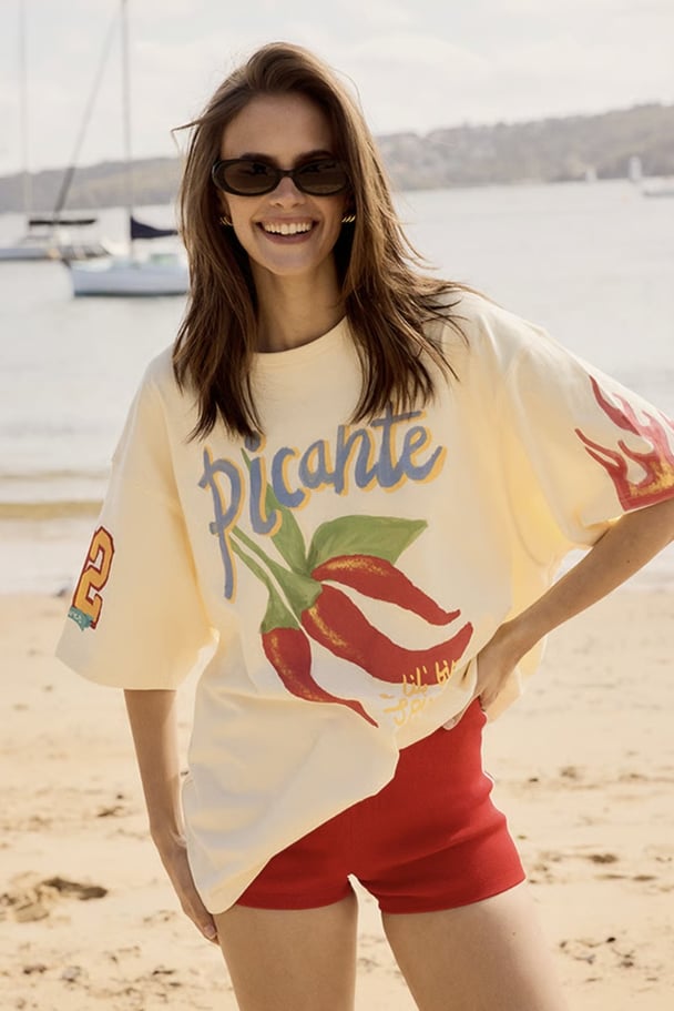 woman on a beach in slogan tee with chillis from Stylerunner