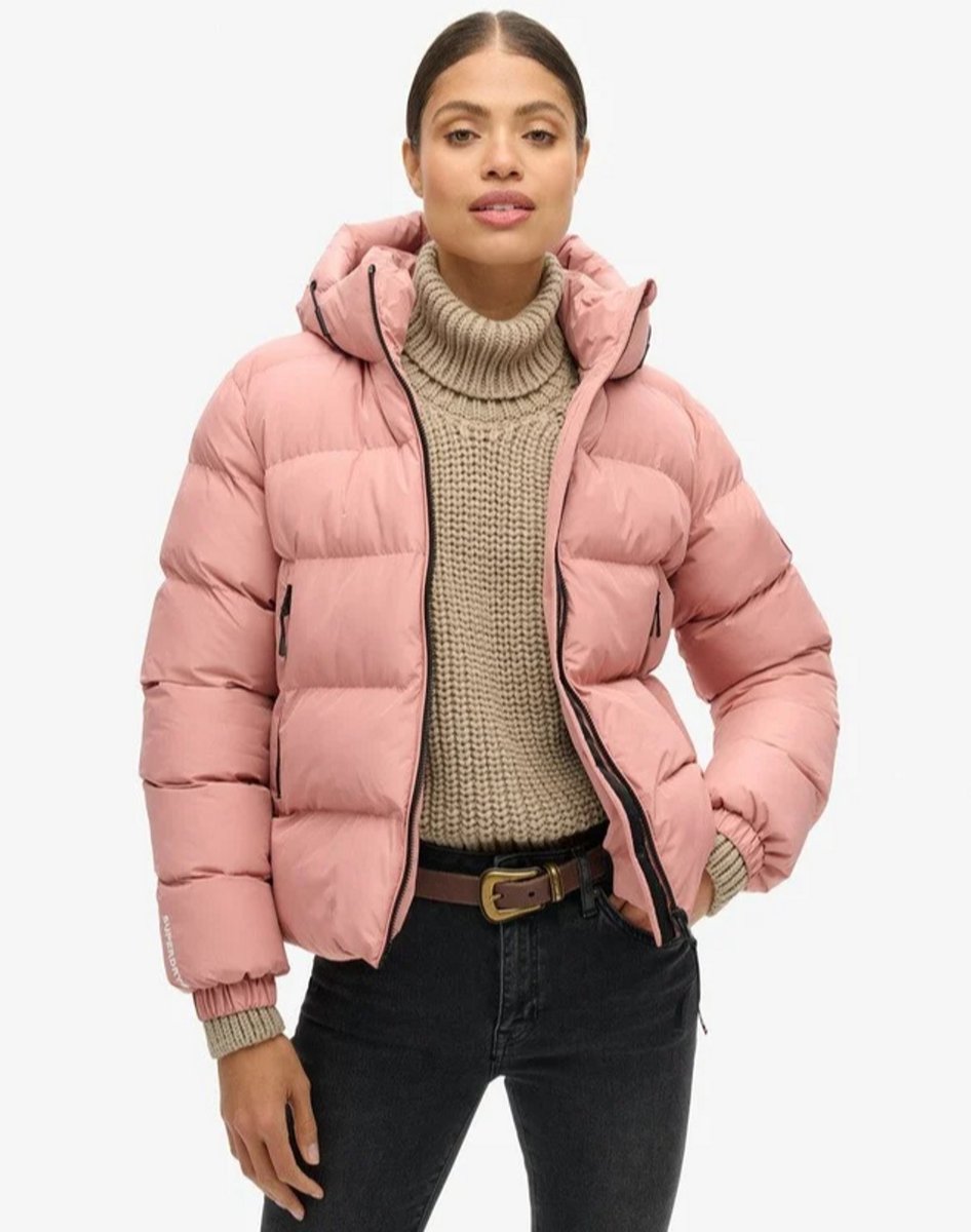 womanwearing pink puffer jacket from Superdry 