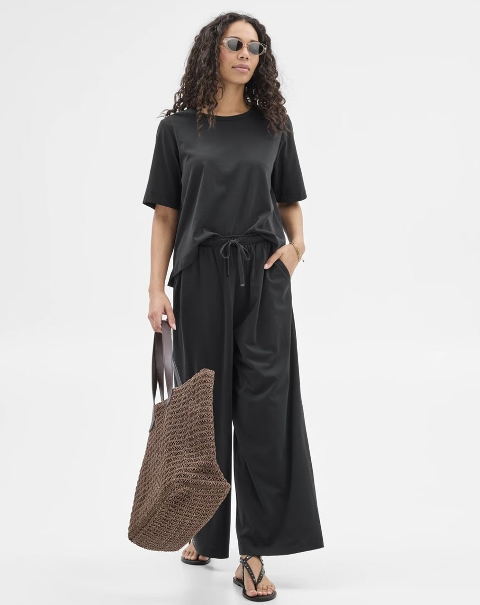 woman wearing realxed set from Target in black 
