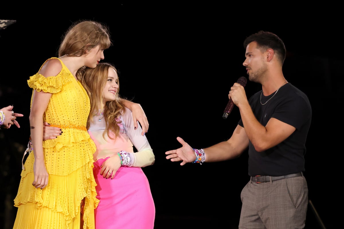 Taylor Swift with Joey King and Taylor Lautner on stage at The Eras Tour on July 7.